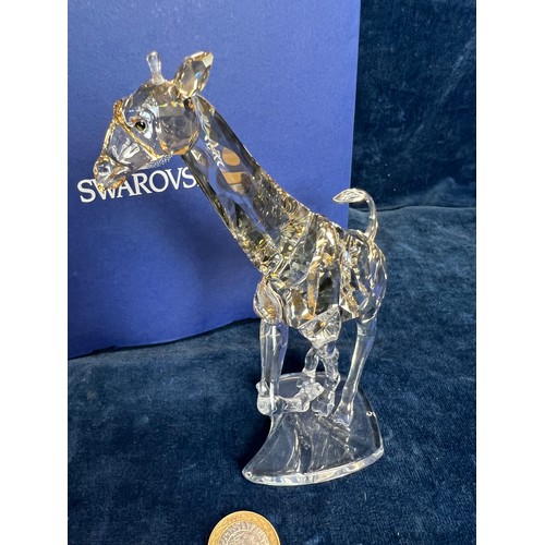 478 - A Swarovski Crystal figure of 'A Giraffe' with original box.