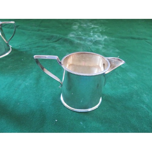 417 - A 3-piece silver-plated tea set comprising teapot, milk jug, 2-handled sugar pot, of plain design.