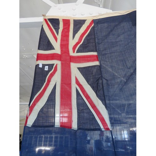 421 - A collection of vintage flags for Great Britain and other countries of various sizes.