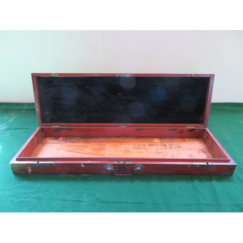 423 - A vintage gun case with brass corners and Bullseye central design (no contents).