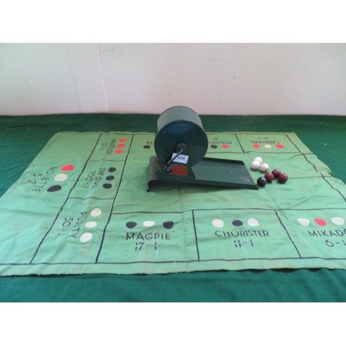 426 - A vintage 'Rolette' game, made in England pat number 393278 with green baize game mat and balls.