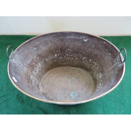 437 - An oval brass bucket with 2 handles.