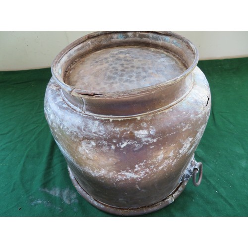 438 - A copper coal scuttle with 2-drop handles mounted with lions and heraldic coat of arms design.