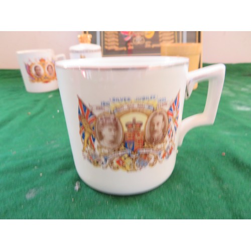 447 - A framed Regimental Coat of Arms and 5 pieces of commemorative ware being 3 mugs, 1 beaker and a bel... 