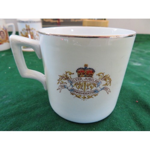 447 - A framed Regimental Coat of Arms and 5 pieces of commemorative ware being 3 mugs, 1 beaker and a bel... 