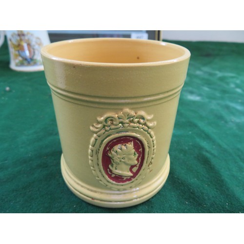 447 - A framed Regimental Coat of Arms and 5 pieces of commemorative ware being 3 mugs, 1 beaker and a bel... 