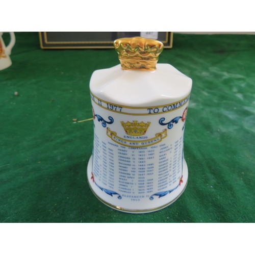 447 - A framed Regimental Coat of Arms and 5 pieces of commemorative ware being 3 mugs, 1 beaker and a bel... 