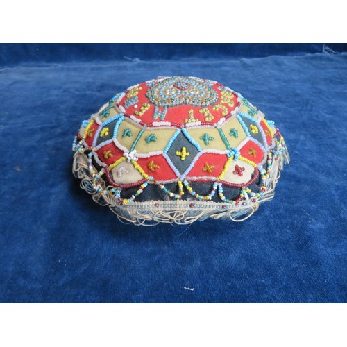 450 - A beadwork cushion with 'Forget-me-not' 1891'.