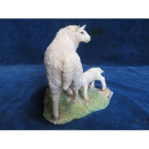 455 - An Aynsley Mastercraft hand-painted figure of a Ewe and lamb.