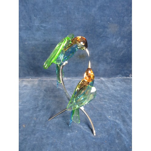 466 - A Swarovski Crystal figure of 2 'BeeEaters' on chrome stand, with original box.