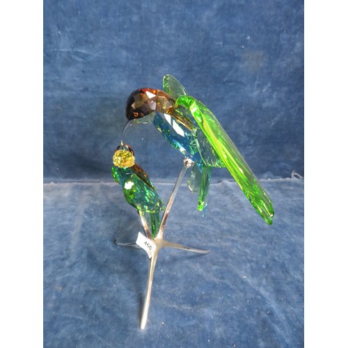 466 - A Swarovski Crystal figure of 2 'BeeEaters' on chrome stand, with original box.