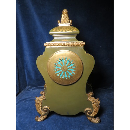 348 - An antique French porcelain clock, having green ground and gilt highlights and ormolu mounts, with a... 