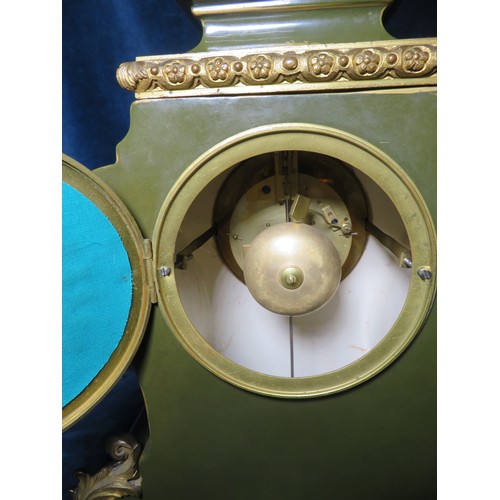 348 - An antique French porcelain clock, having green ground and gilt highlights and ormolu mounts, with a... 