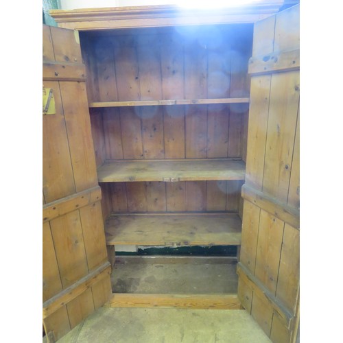 769 - A vintage pine 2-door kitchen cupboard with metal hinges, 3 fitted shelves and a vintage 