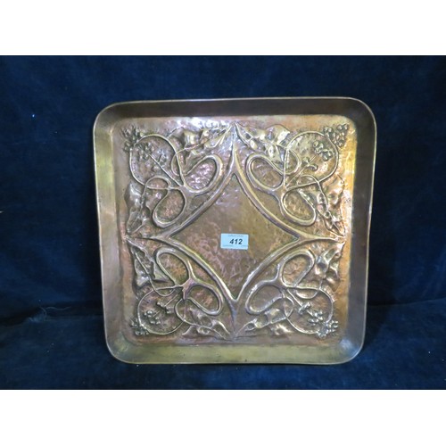 412 - A large square hammered copper Arts and Craft tray with embossed Art Nouveau design, from The Keswic... 