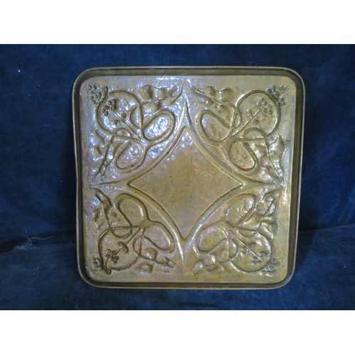 412 - A large square hammered copper Arts and Craft tray with embossed Art Nouveau design, from The Keswic... 