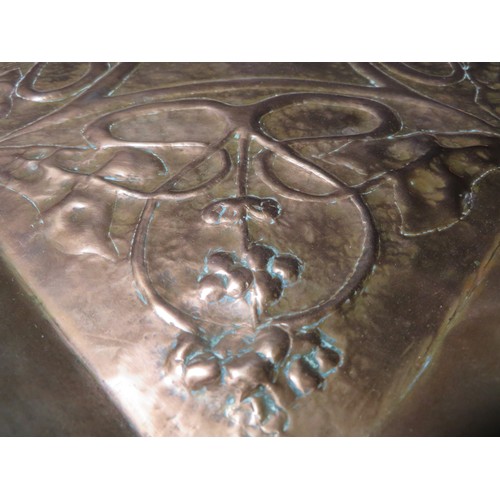 412 - A large square hammered copper Arts and Craft tray with embossed Art Nouveau design, from The Keswic... 