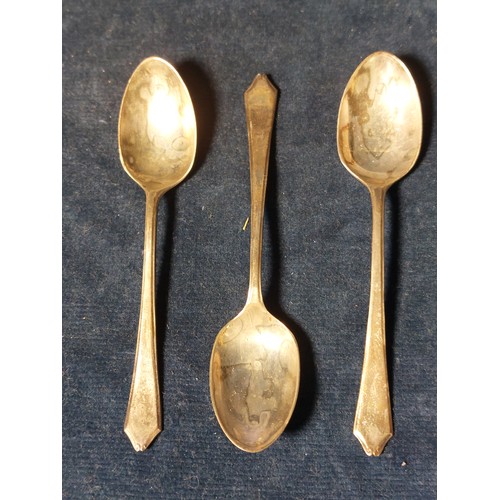 175 - Three silver teaspoons of matching design, hallmarked Sheffield, having shaped handles of plain desi... 