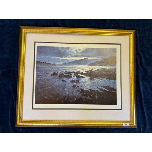 85 - A framed coloured print by A.B. Hayman being limited edition number 80 of 400 depicting mountain/lak... 