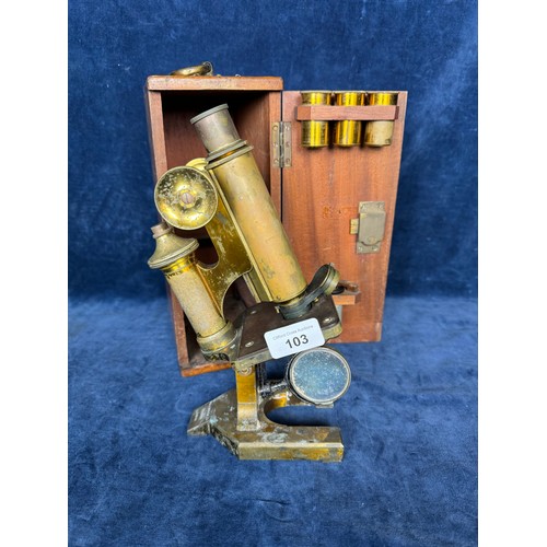 103 - A brass microscope made by R & J Beck Ltd, London - No 24710, in the original case.