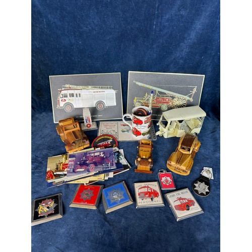 112 - A box containing Fire Service memorabilia, including plaques, postcards, badges, belt, etc., also wo... 