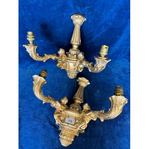 118 - A pair of gilded 2 branch wall lights mounted with cherub decorations.