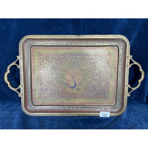 136 - A vintage brass 2-handled serving tray with elaborate etched and coloured decoration with central pe... 