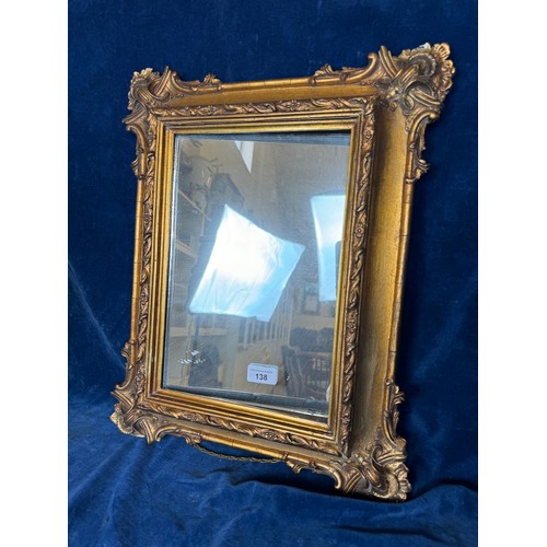 138 - An antique carved gilt frame mirror.