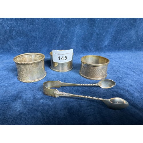 145 - Three silver napkin rings, one of plain design engraed 