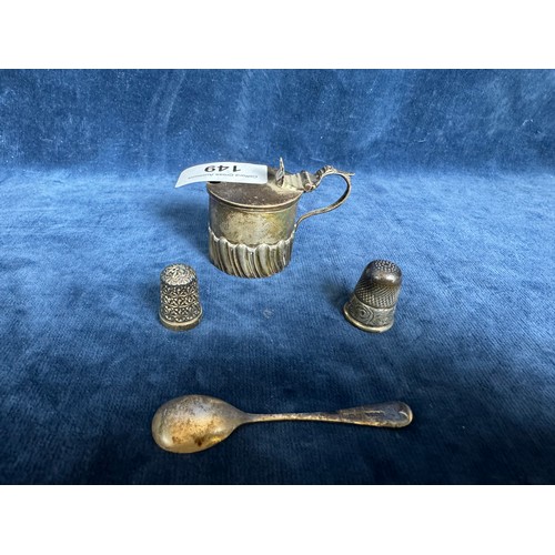 149 - A small silver condiment pot with hinged lid and decorative design (no liner) hallmarked Chester, a ... 