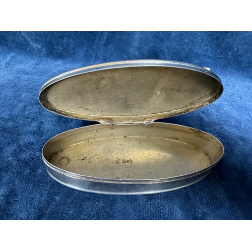 155 - A silver oval shaped lidded trinket box, hallmark Chester 1909 and marked 