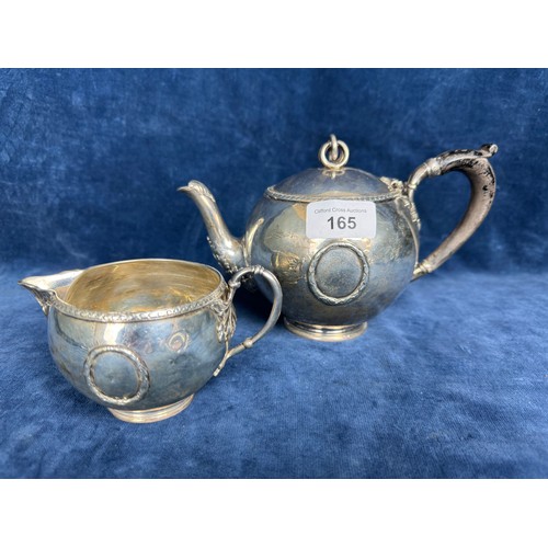 165 - A Silver bachelors teapot and milk jug both marked to the base 