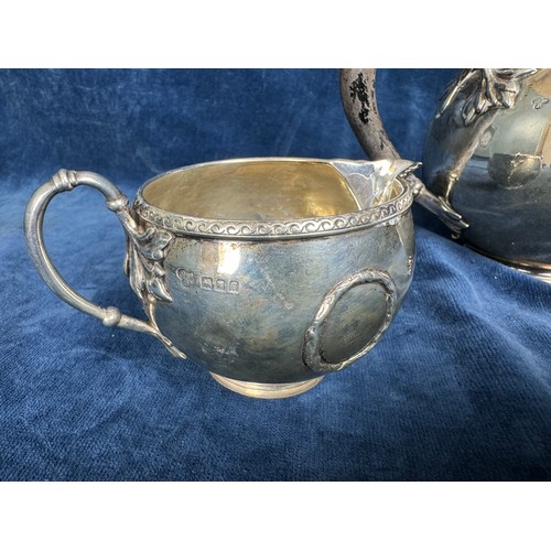 165 - A Silver bachelors teapot and milk jug both marked to the base 