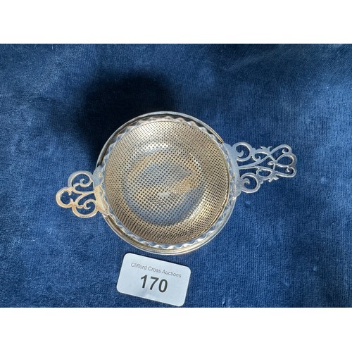 170 - A Silver tea strainer and bowl on 3 feet, both hallmarked Birmingham and marked J.B.C and S