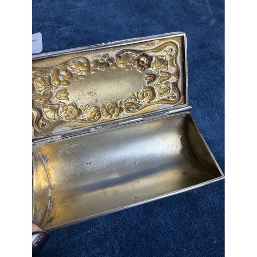 172 - A small hallmarked silver box having hinged lid and with floral decoration and shaped feet (marks wo... 