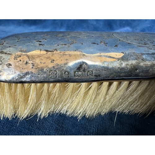 183 - An hallmarked silver clothes brush marked 