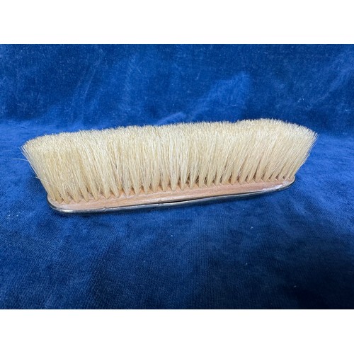 183 - An hallmarked silver clothes brush marked 