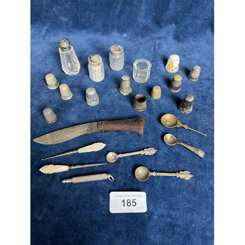 185 - A small quantity of collectible items including thimbles of various designs, cut glass bottles, smal... 