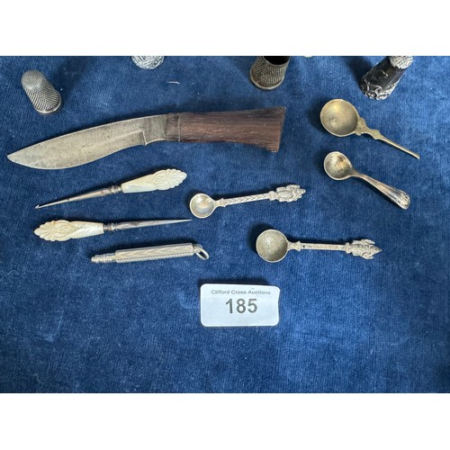 185 - A small quantity of collectible items including thimbles of various designs, cut glass bottles, smal... 