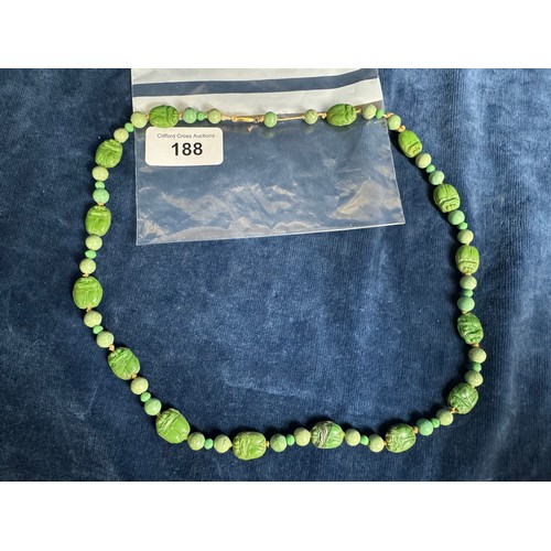 188 - A 20th Century Jade necklace with carved beads depicting Scarab Beatles