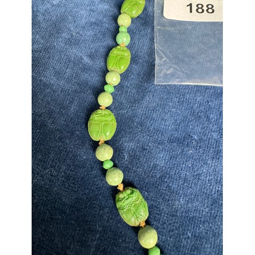 188 - A 20th Century Jade necklace with carved beads depicting Scarab Beatles