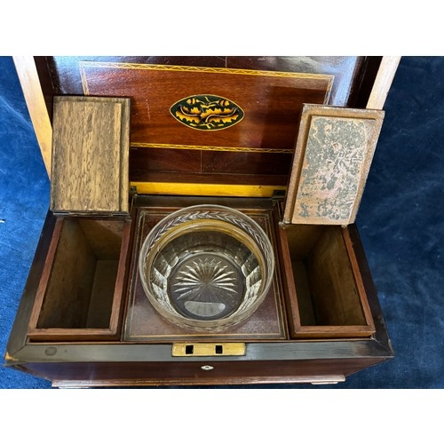 137 - An antique mahogany tea caddy with inlaid decoration having a cut glass mixing bowl, 2 removable hin... 