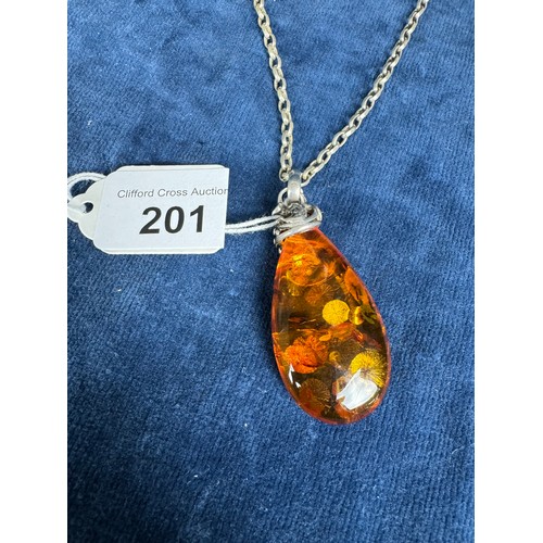 201 - A 20th Century silver mounted Amber stone on a silver chain.