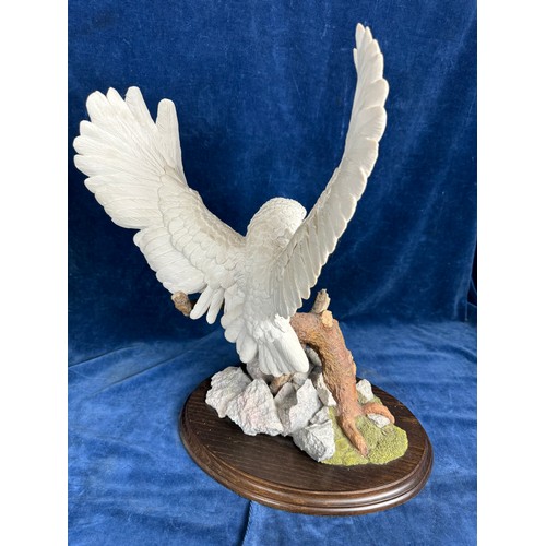 230 - A Country Artist's figure being limited edition 'White Splendour,' CA625, on wooden base.