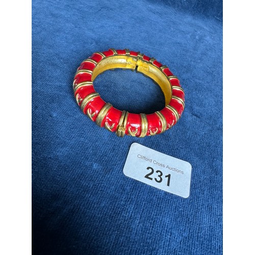 231 - A gold coloured metal and red enamel bracelet by Bijoux, Caccio, Italy