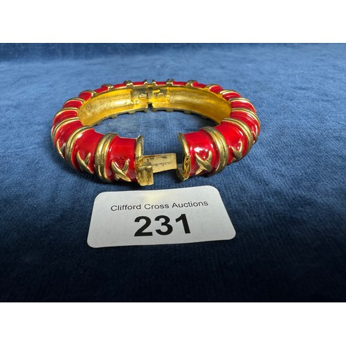 231 - A gold coloured metal and red enamel bracelet by Bijoux, Caccio, Italy