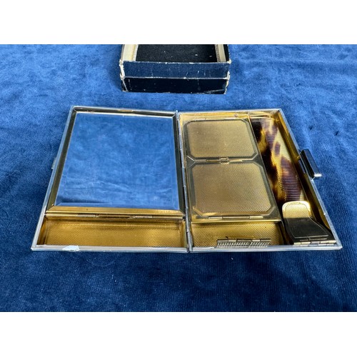 272 - An Art Deco style ladies compact/cigarette case with comb with original central Jade inset, in origi... 