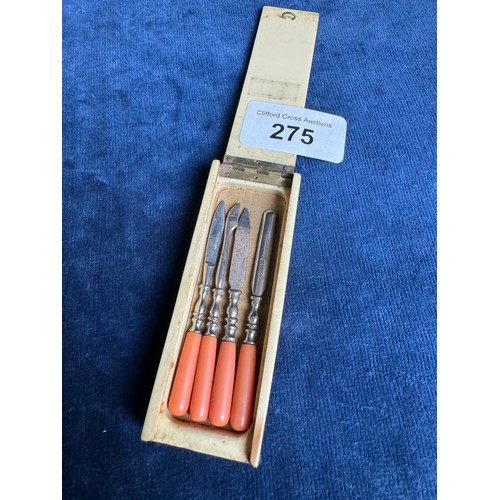 275 - A vintage miniature manicure set with coral handles in original box and marked 