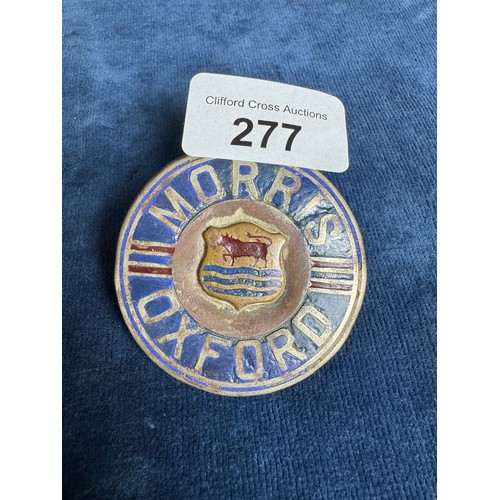 277 - A vintage metal badge for a 