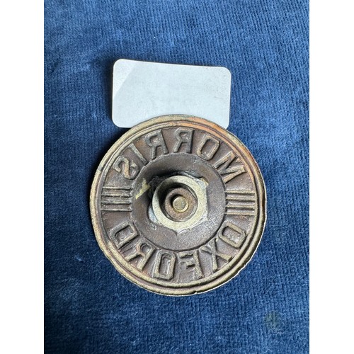 277 - A vintage metal badge for a 